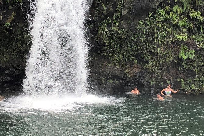 Road to Hana & Bamboo Forest on Maui Tours - Hawaii waterfall with swimmers on the Road to Hana Tour