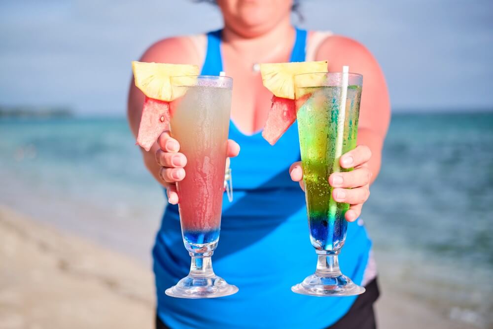 Tourist in Fiji getting two drinks for the price of one