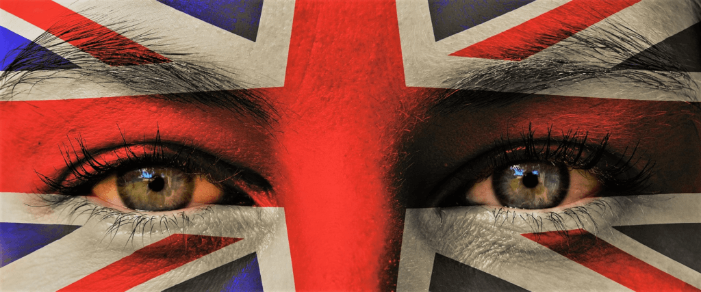 flag of the UK, the Union Jack, is painted on a face.